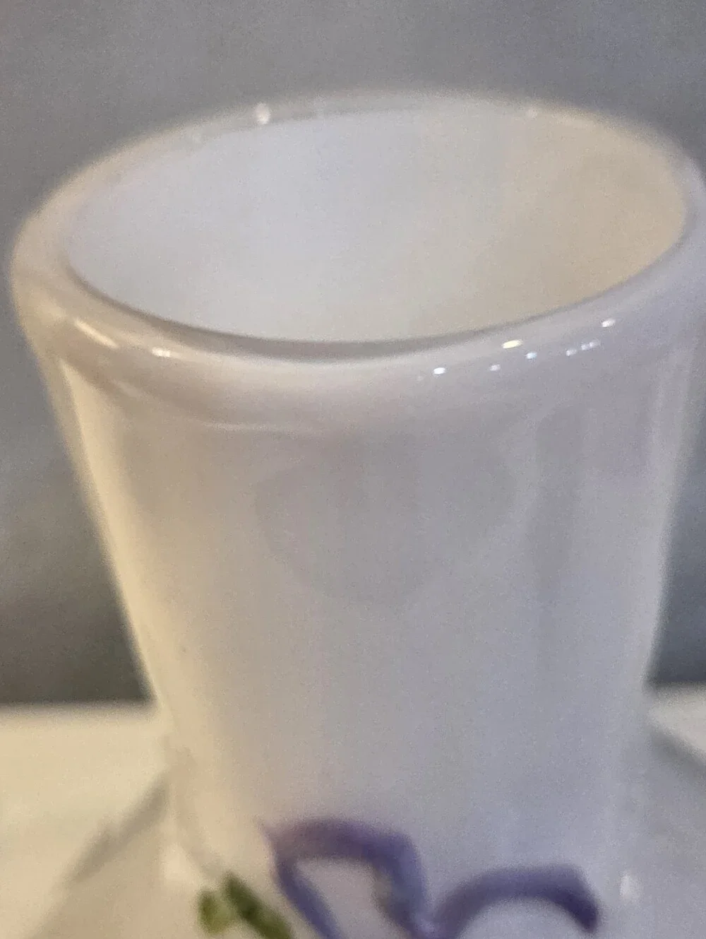 White Glass Vase With Raised Delicate Purple Flowers And Green Vines